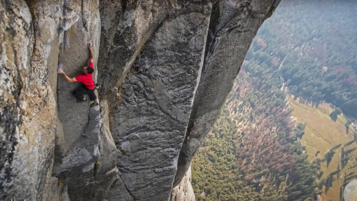 a man climbing a rock wall