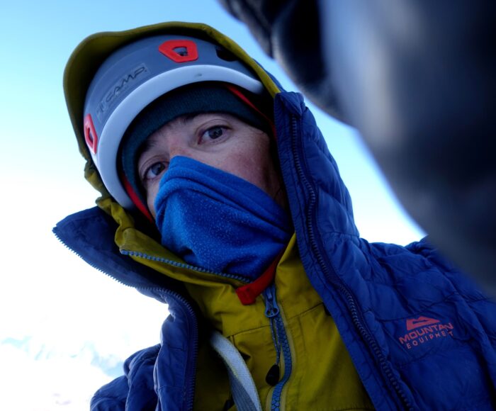 Husherka with helmet, hood and a fleece over his mouth and nose. 