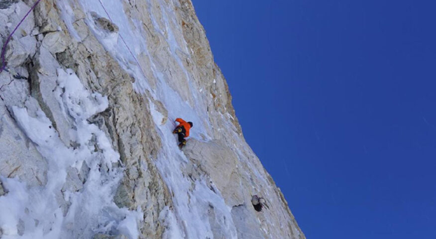 tiny climbers on a big rock face