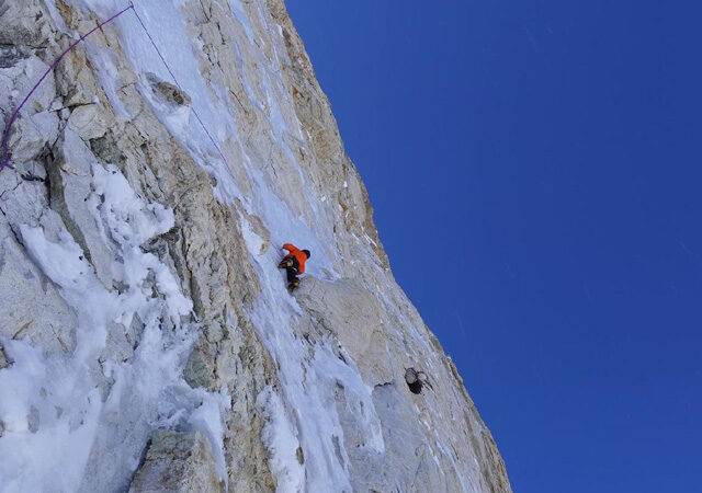 tiny climbers on a big rock face