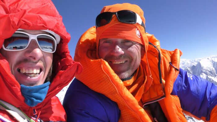 The climbers smile on a summit picture