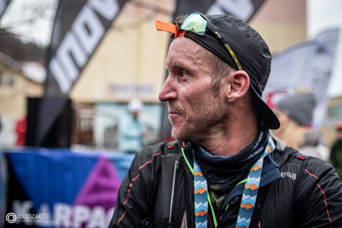 Close shot of Oswald Pereira with a cap and running clothes. 