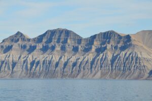 Mountains and the sea, with no snow or ice