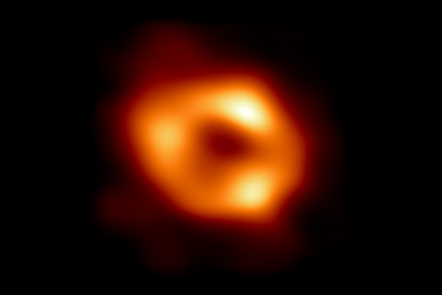 dark universe and in the center, a fuzzy orange blob