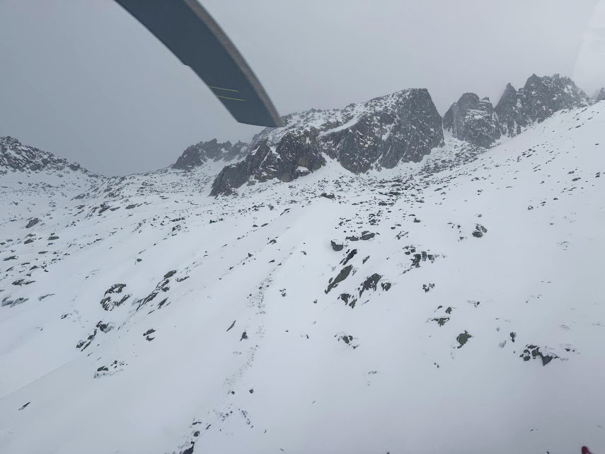 foggy mountain scene from a helicopter