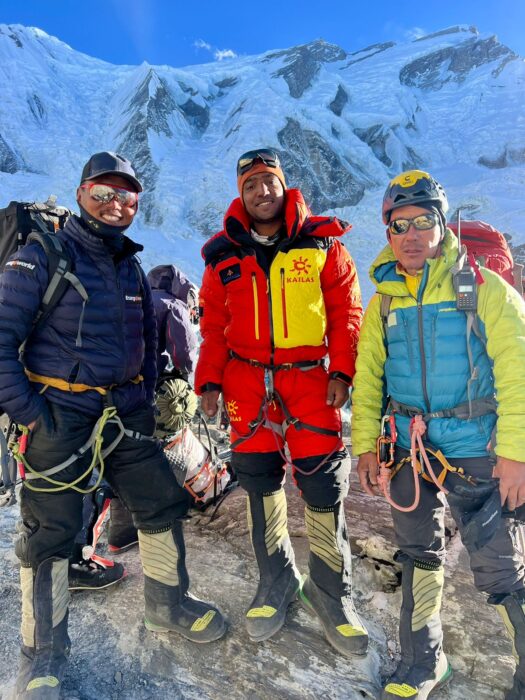 Cheppal, Sajid and Gelu with high altitude clothes and harnesses, on Annapurna Base Camp