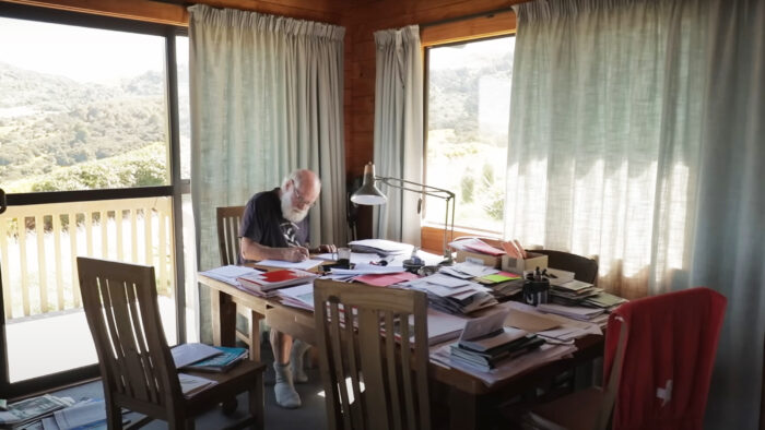 a man sits at a table 