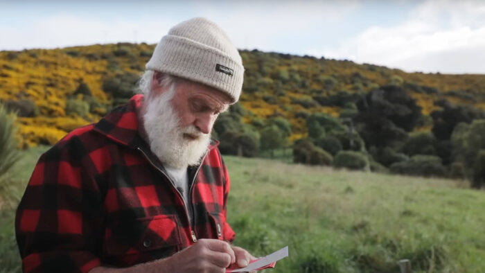 a man writes in a notebook