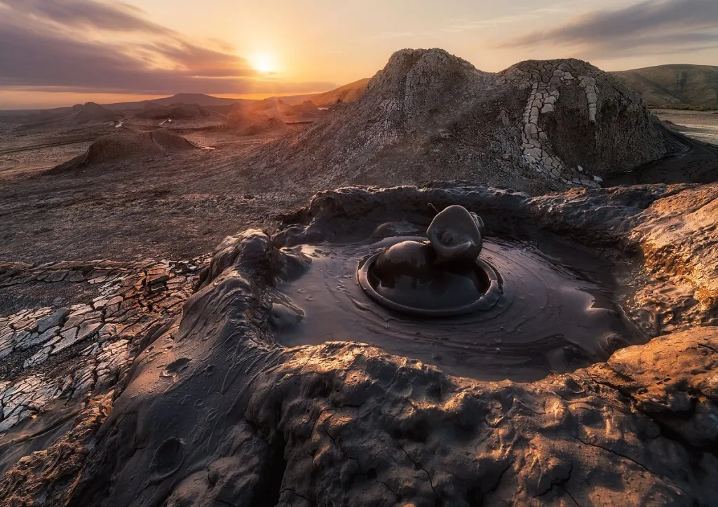 A bubbling pool of mud in a desert.