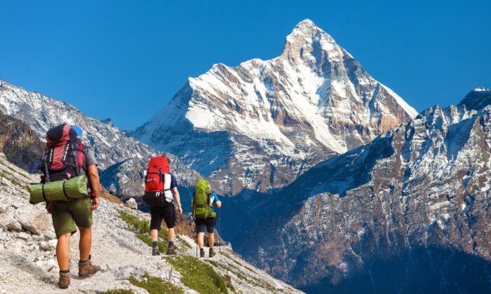 A line of trekkers approaching Nanda Devi, India