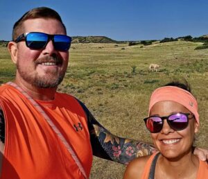 outdoorsman and his wife in sunglasses