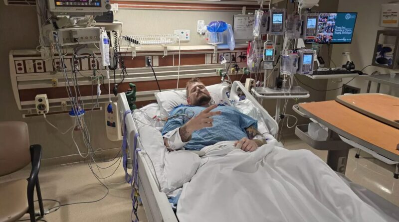 man in hospital bed