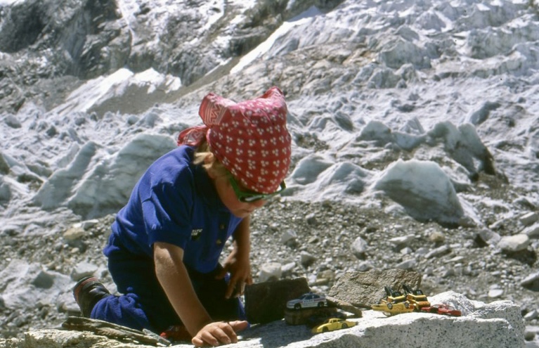 The little Tom Ballard paying with toy cars at Everest Base Camp in 1994.