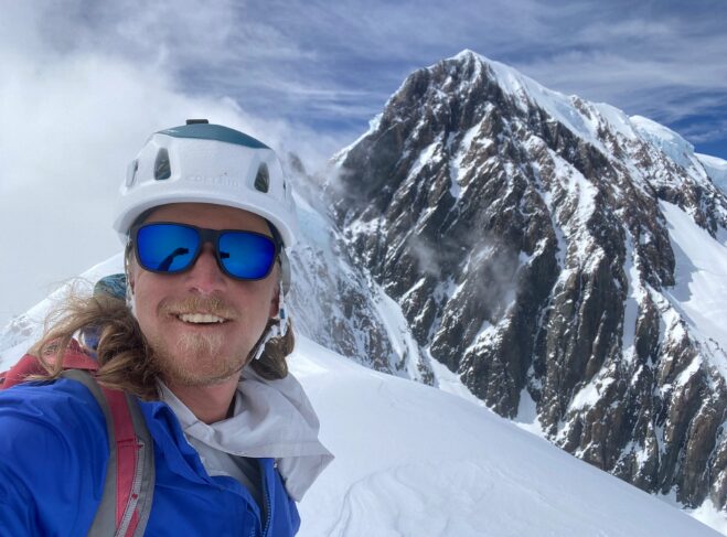 Nathan Lockhust with climbing helmet and mirror glasses.