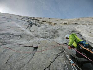 A climber belay another on a granite Patagonia big wall