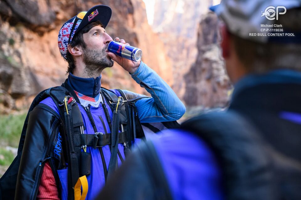 A man drinking a refreshing Red Bull