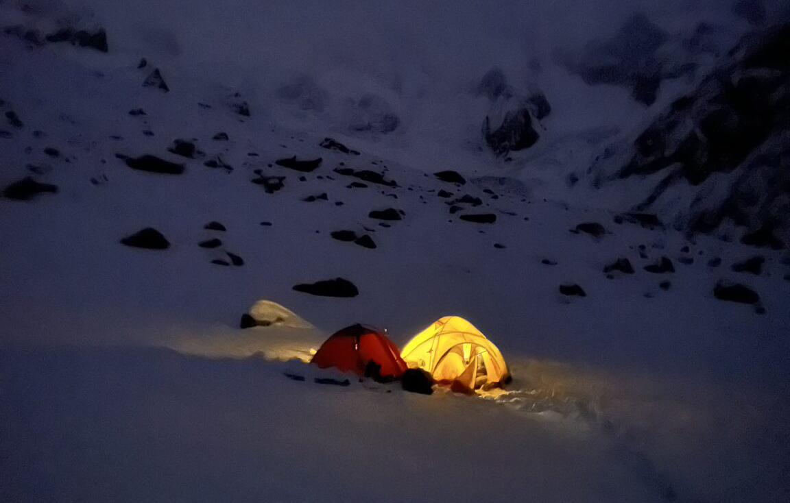 tents lit at night