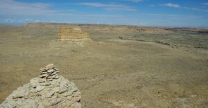 A stone cairn on a plain.