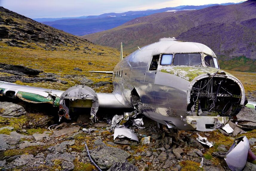 The broken fuselage of a plane on the mountainside