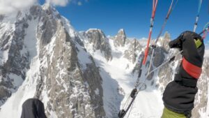 paragliding in big mountains from paraglider's perspective