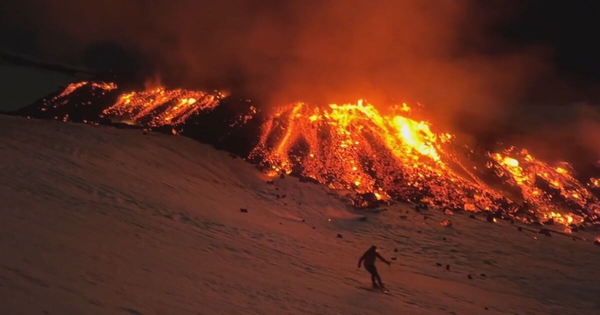 skier on erupting volcano