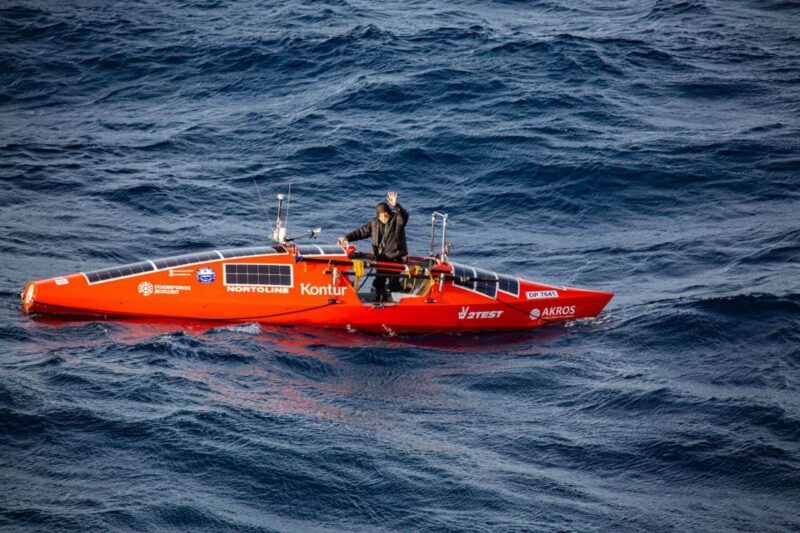 ocean rower in red boat