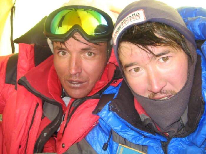 Close shot of Pivtsov and Zhumayev dressed in warm mountain jackets. 