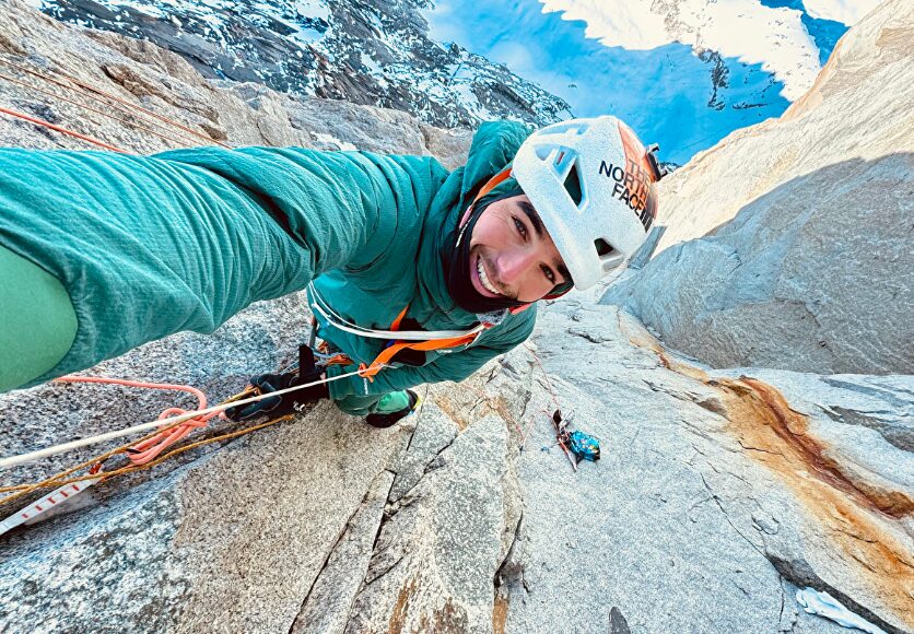 Vedrines takes a selfie from a belay while soloing Dru, Alps