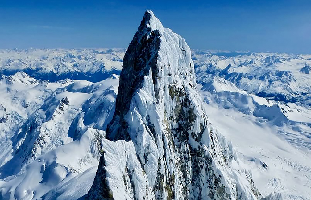 A remote and snowy mountain spire