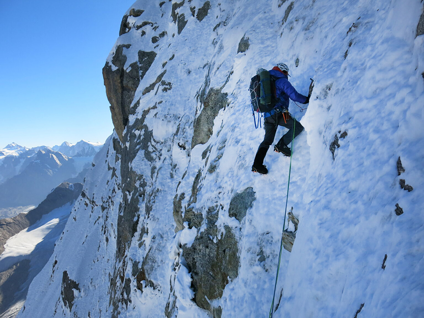 climber on snowy wall