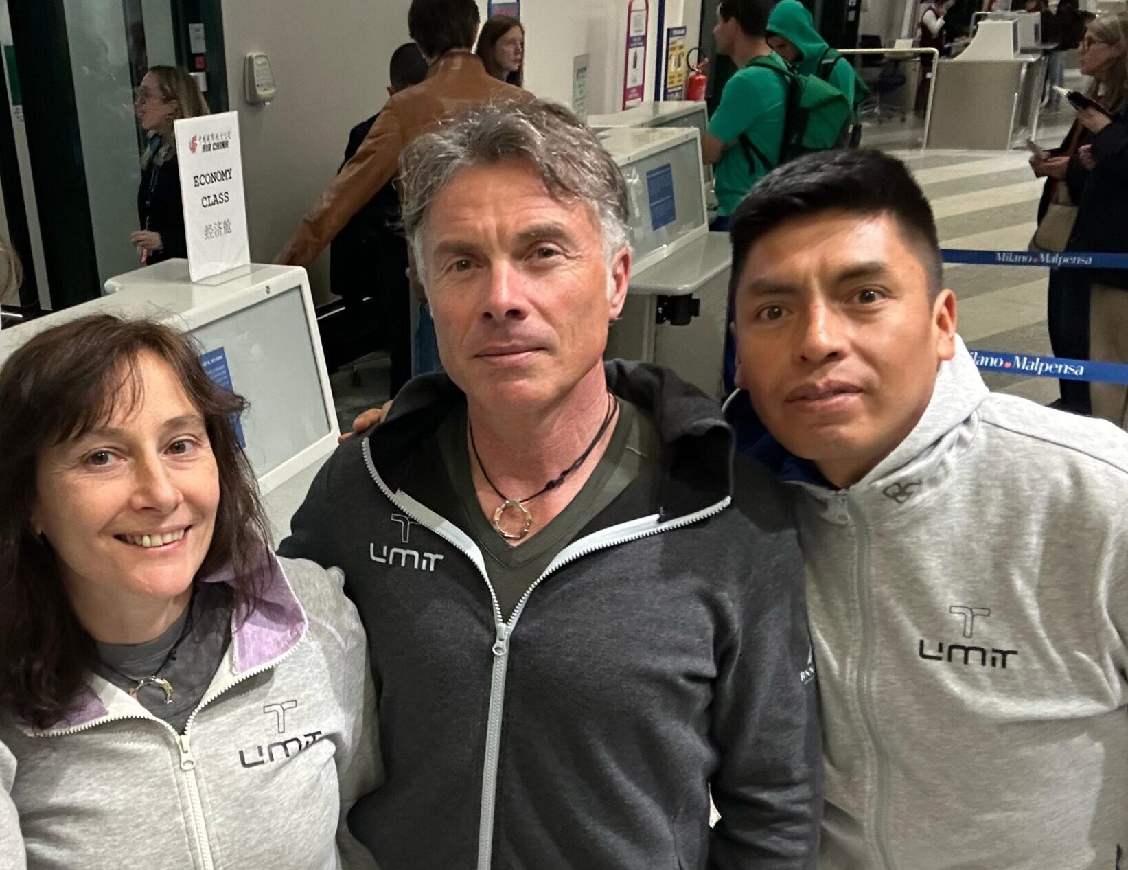 The climbing team takes a selfie at the airport