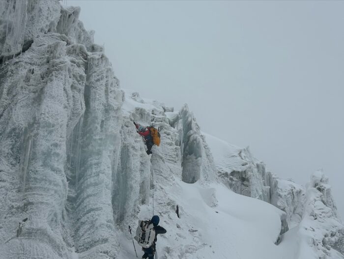 Nepalese climbers among water-ice seracs.