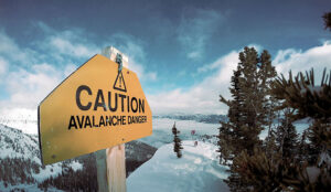 avalanche danger sign on hilltop