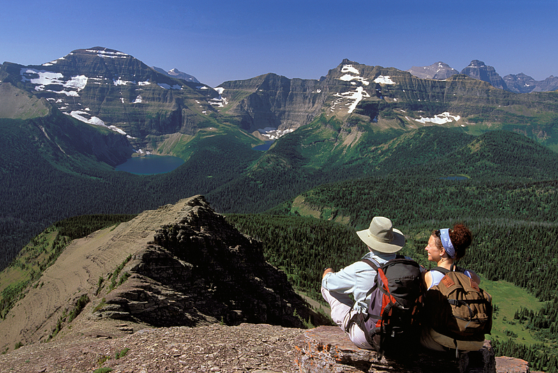 two hikers on mountaintop