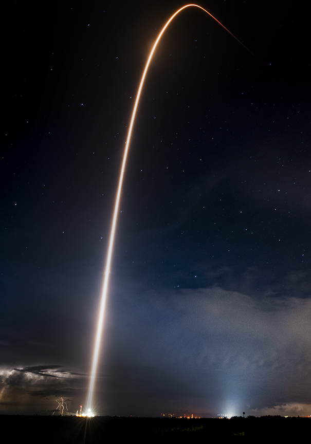 curved white line showing rocket's trajectory