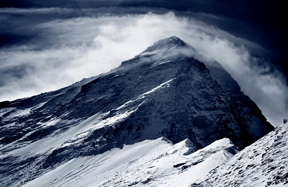 Everest West Ridge on a turbulent day, with clouds