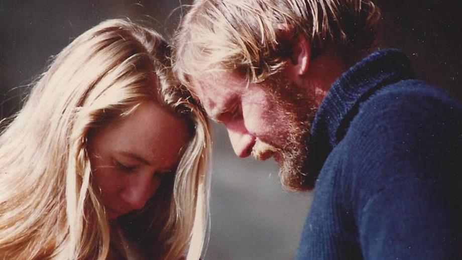 A woman and a man pressing their foreheads together