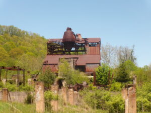 An abandoned mill surrounded by cinderblocks.