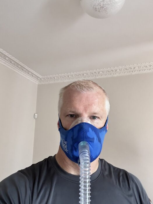 Alastair Carns with his face covered by a mask during an hypoxic training.