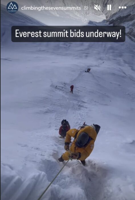 Climbers heading up a snowy ramp on Everest