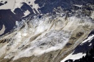 Stone, ice and mud avalanche partially buries Blatten Village in the Swiss Alps.