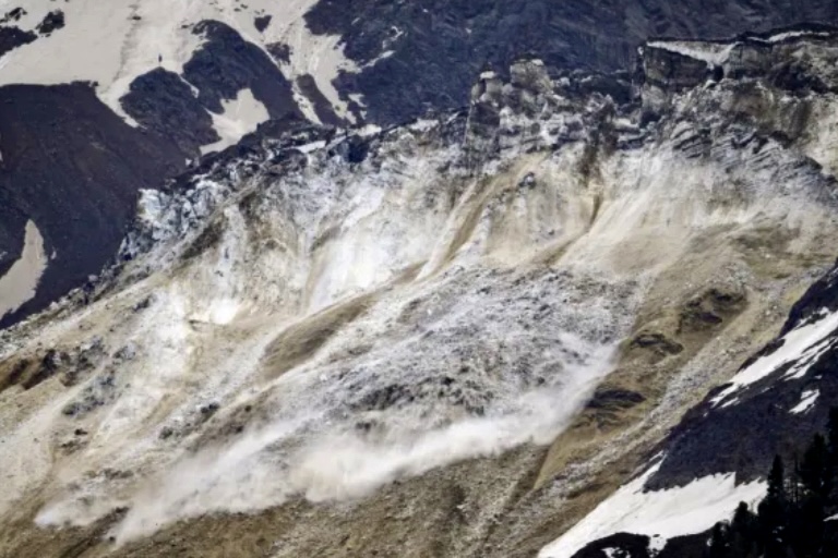 Stone, ice and mud avalanche partially buries Blatten Village in the Swiss Alps.