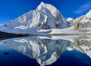 The North Face of Kirat Chuli reflected in the Changsang Glacier lake to the northeast. The 2022 attempt is marked in red.