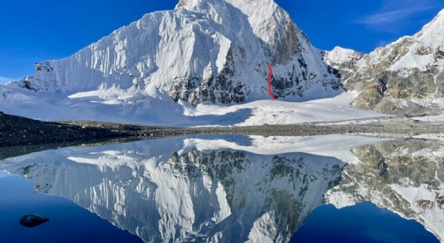 The North Face of Kirat Chuli reflected in the Changsang Glacier lake to the northeast. The 2022 attempt is marked in red.
