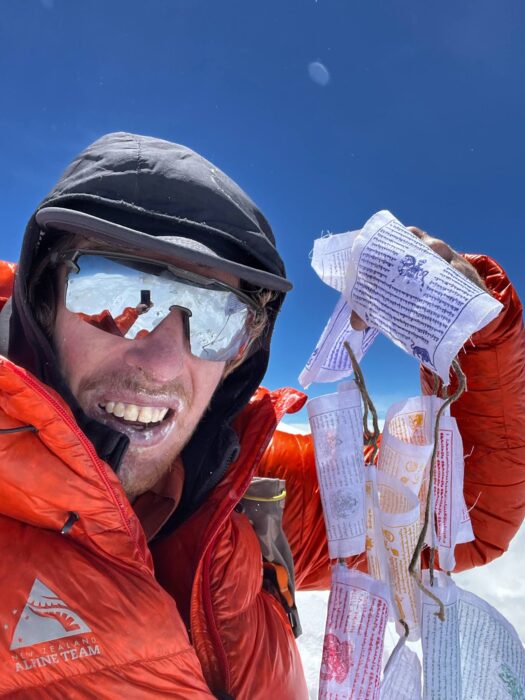 Close shot of Matthew scholes on the summit of Makalu, May 4, 2025.