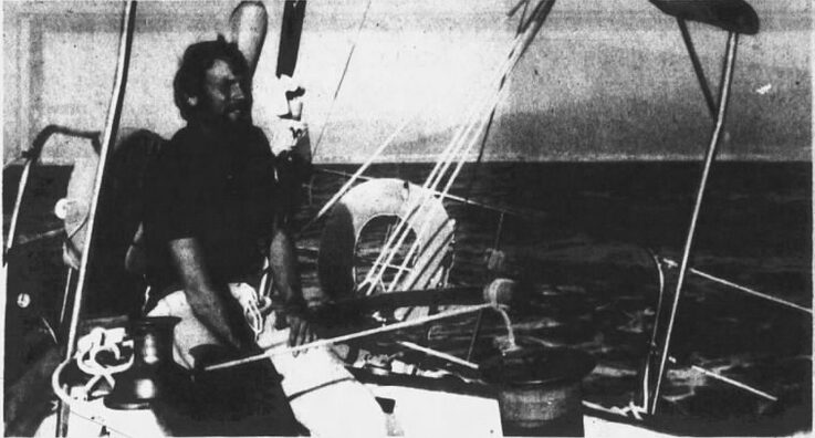 A man sitting in a sailboat