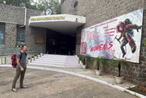 Us climber Sean McLane at the gate of the Indian Mountaineering Foundation offices.