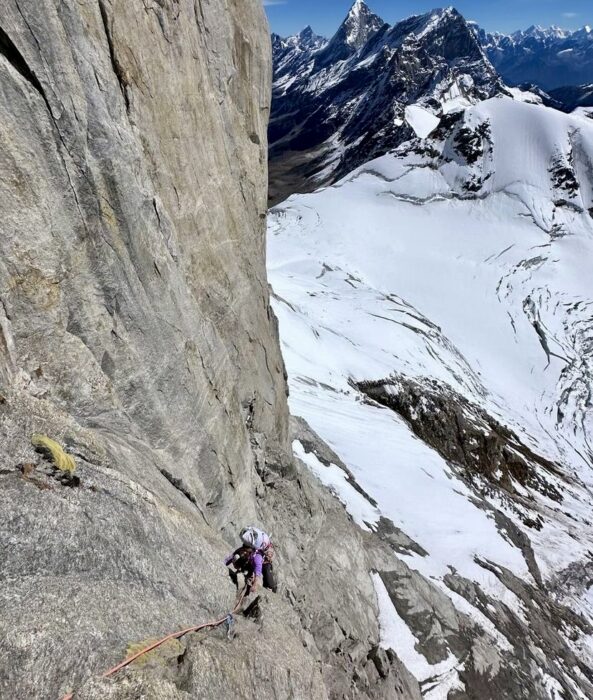 a climber on a rocky buttress of Chaukhamba III, Indian Himalaya.