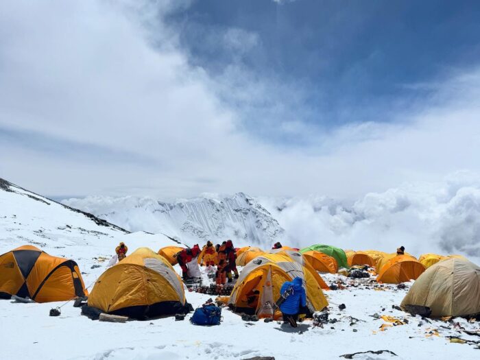 Tents and climbers on the wide South Col of Everest.