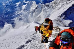Climbers on a fixed rope going up on Rverest